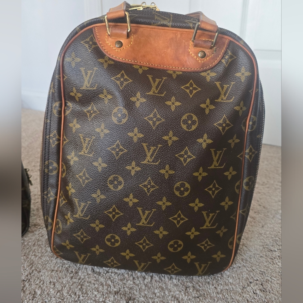 LV 90's Era Monogram Canvas Excursion Bag.